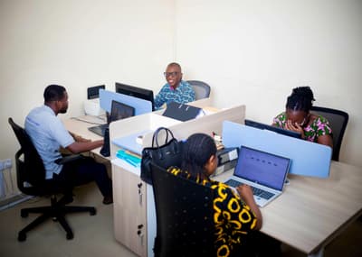 Four LCS team members working at their desks